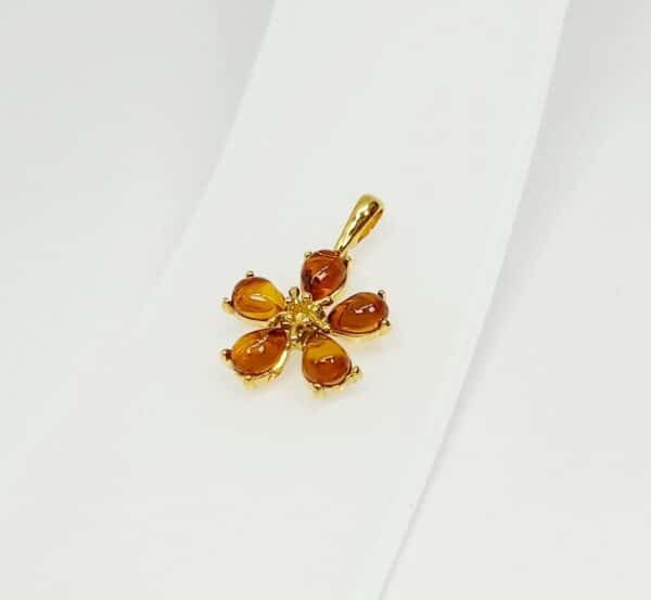 vergulde cognac amber hanger bloem